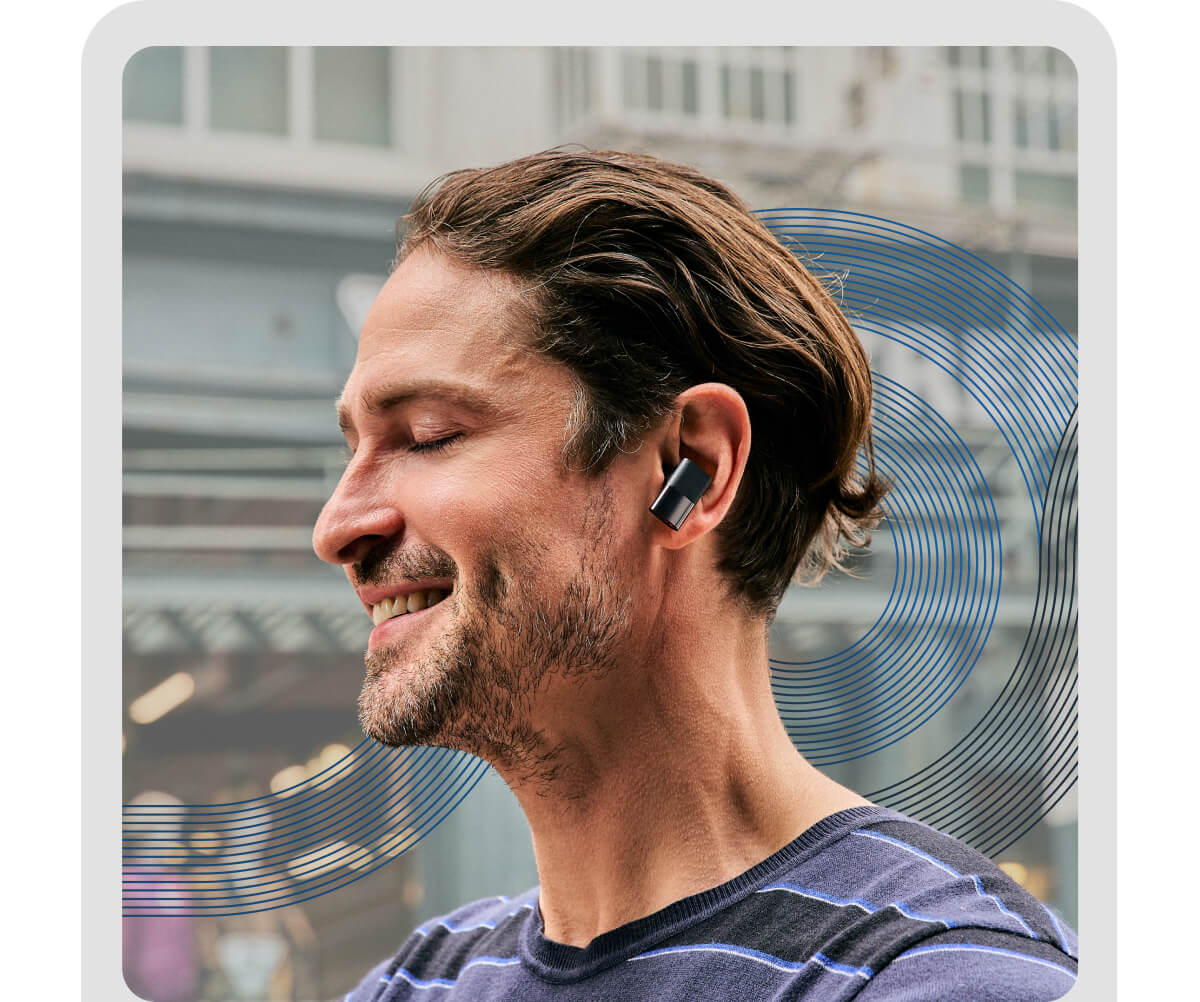 Man feeling the music, wearing Status' earbuds